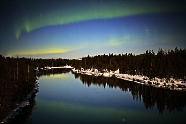 istock Northern lights over Skellefte River in Swedish lapland 1337216235