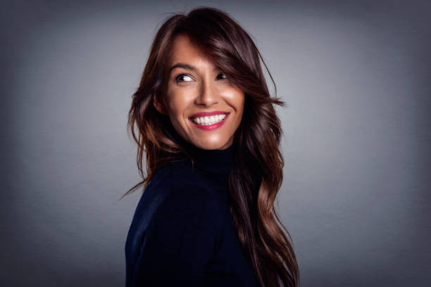 istock Happy middle aged woman studio portrait 1337217518