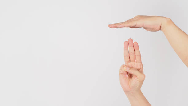 istock Safety Stop by Hold a flat hand over three raised fingers hand sign isolated on white background. 1337220432
