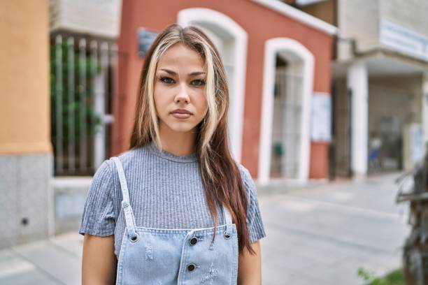 istock Young caucasian woman outdoors relaxed with serious expression on face. simple and natural looking at the camera. 1337222345