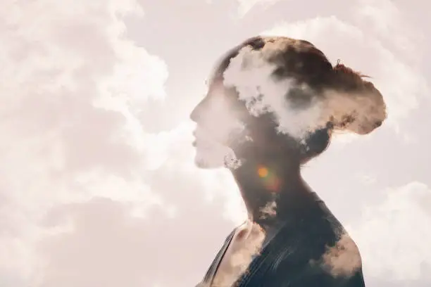 Photo of Psychology concept. Sunrise and woman silhouette head