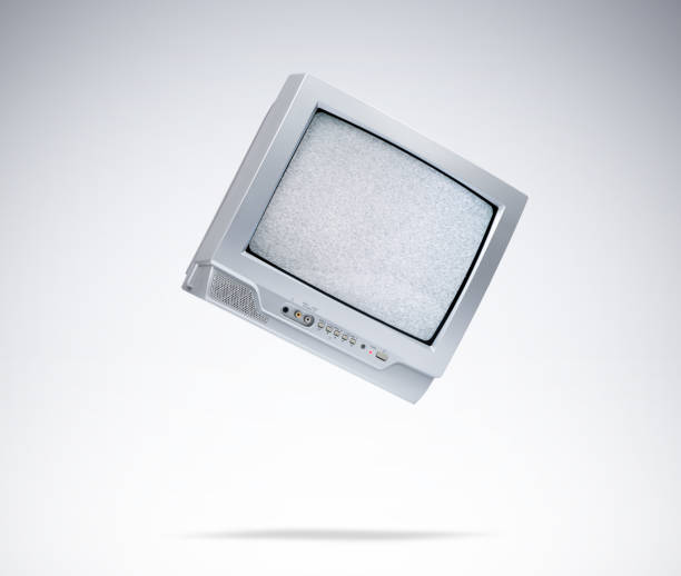 istock Working old CRT TV in the fall, noise and interference on the screen, on light gray background. File contains a path to isolation. 1337222931