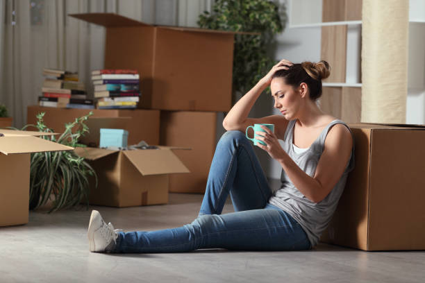 istock Sad evicted woman moving home complaining on the floor 1337223279