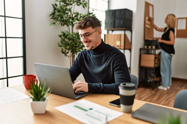 istock Two business workers smiling happy working at the office. 1337223332