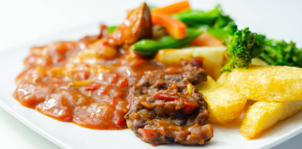 istock Pulled pork in barbecue style sauce with barbecues style beans with spiced chips and fresh vegetables 1337225346
