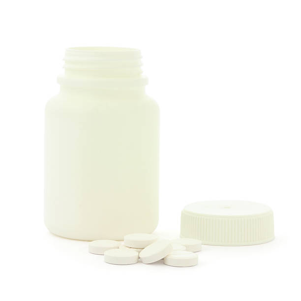 istock Medicine bottle and white pills 133722560