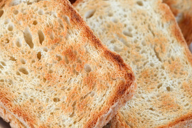 istock Croutons or bread toasts close-up view fried on grill 1337225896