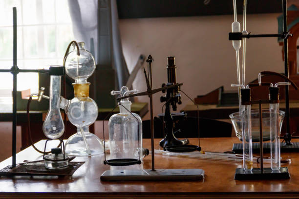 Flasks and chemical equipment in old laboratory stock photo