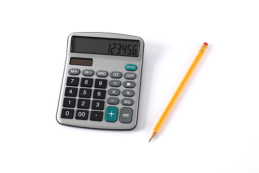 Stressed Asian woman hand touching head and have a headache with holding black calculator on pink background.