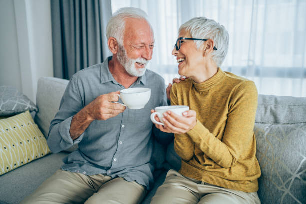 istock Couple drinking coffee on the sofa. 1337231054