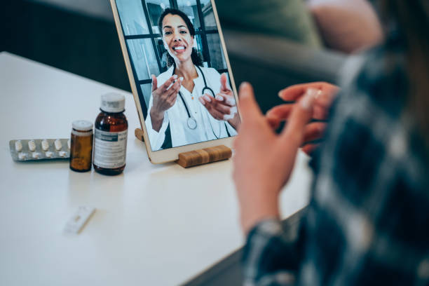 istock Young woman video chats with doctor. 1337231238