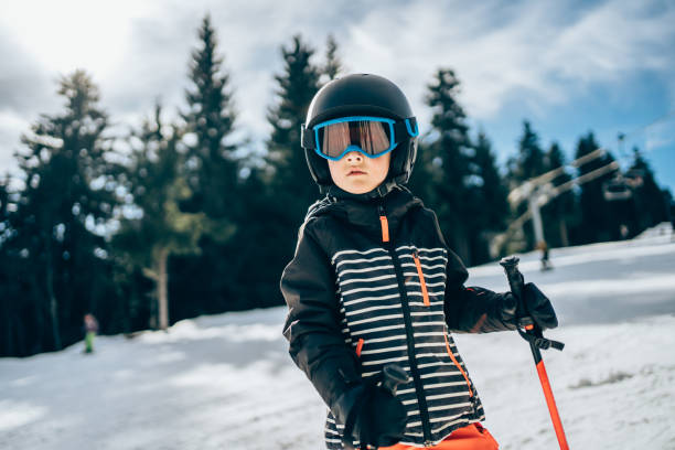istock Smiling cute boy on skiing. 1337231578