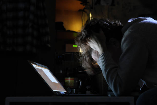 istock Mature woman is working late at home 1337234236