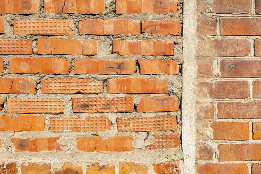 Texture of ancient brick wall of antique building as background.