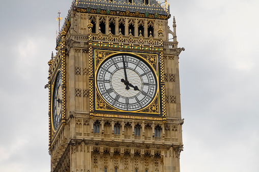 London, United Kingdom - June 05, 2010: A close-up view of London's popular monument. Clock tower known around the world as Big Ben shows rush hour, 4pm