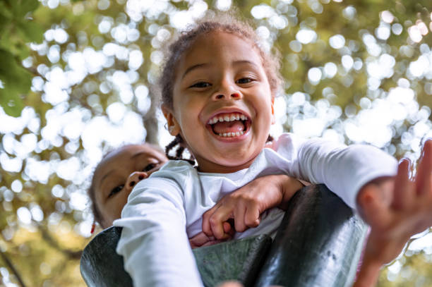 istock Cheerful boy and girl smiling while looking at camera 1337235779