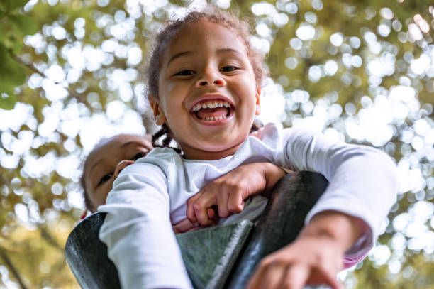 istock Cheerful boy and girl smiling while looking at camera 1337235785