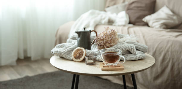 istock Autumn home composition with a cup of tea, a teapot and a knitted element. 1337235835
