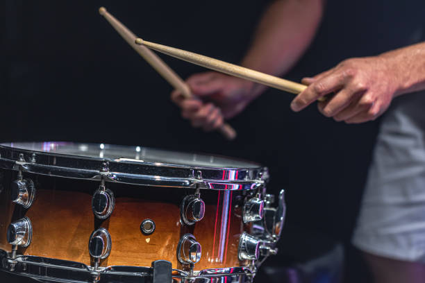 istock The drummer's hands hold drumsticks and play the snare drum. 1337237161