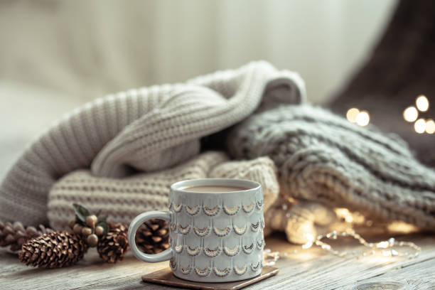 istock Cozy winter composition with a cup and decor details on a blurred background. 1337239061