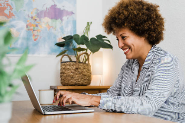 istock Senior african woman using laptop computer at home office - Focus on face 1337240132