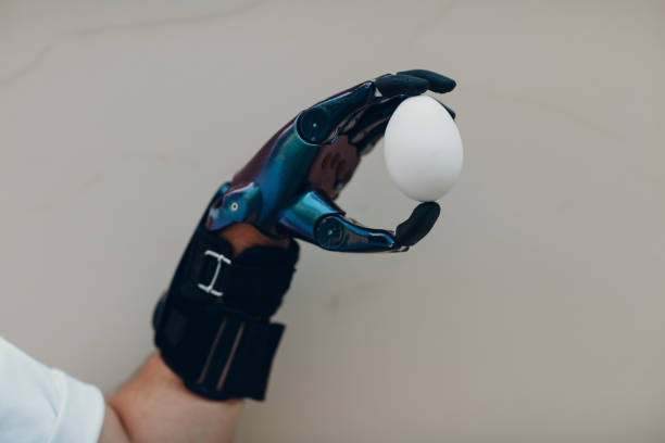 istock Young disabled man hold egg with artificial prosthetic hand in casual clothes. 1337241317