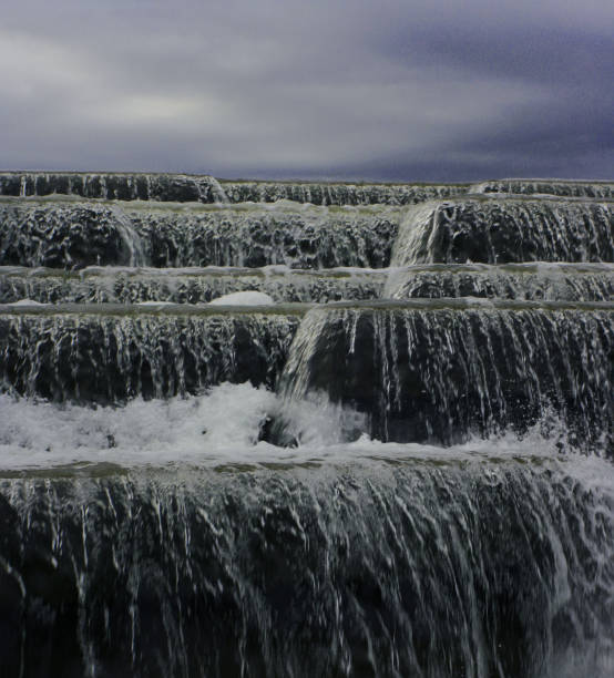 istock Close-up waterfall on the background of the cloudy sky. 1337241416