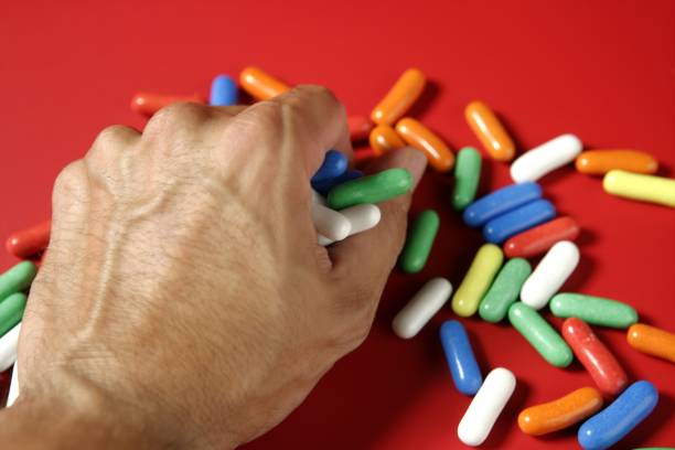 istock Human hand holding colorful candy 1337242087