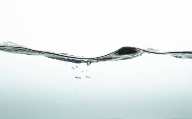 istock water wave with bubbles on white background. Water splash isolated on the white background. 1337243377