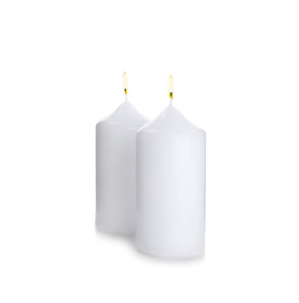 istock Wax candles with wicks isolated on white 1337243891