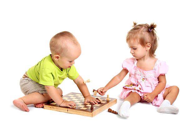 Children playing chess stock photo