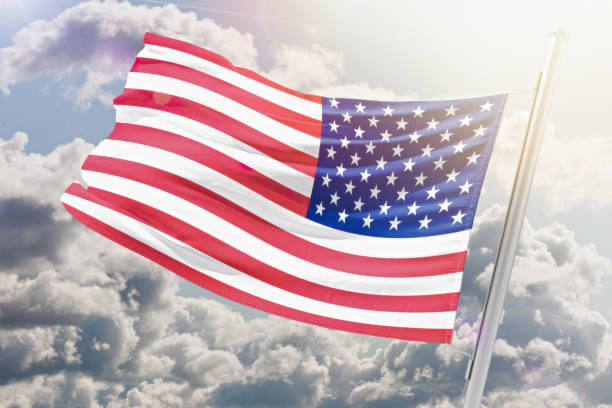 11 September USA Patriot's Day USA Patriot's Day background on the American flag.The flag of the United States of America flutters in the winds in the soft light of sunset, American Independence Day 11 de septiembre dÍa del patriota de ee.uu. día del patriota de ee.uu. antecedentes de la bandera estadounidense. la bandera de los estados unidos de américa ondea en los vientos a la suave luz del atardecer, día de la independencia de los estados unid