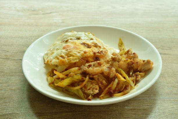 istock stir fried pork with sweet long pepper and onion with chili paste topping egg on rice 1337245592