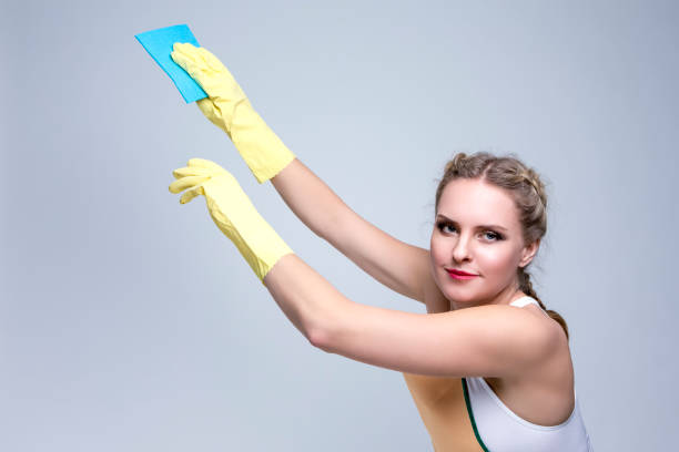 istock Working Caucasian Female Holding Blue Cleaning Sponge While Working With Rubber Gloves. Horizontal Image 1337245612
