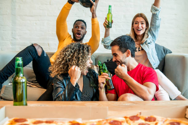 istock Friends having good time while watching a match together. 1337245701