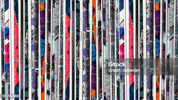 Old Comic Books Stacked In A Pile Creates Colorful Paper Background Pattern Of Shapes And Textures Stock Photo - Download Image Now