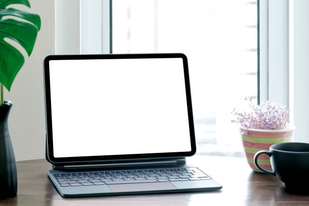 istock Home office mockup with blank screen tablet and keyboard. 1337246209