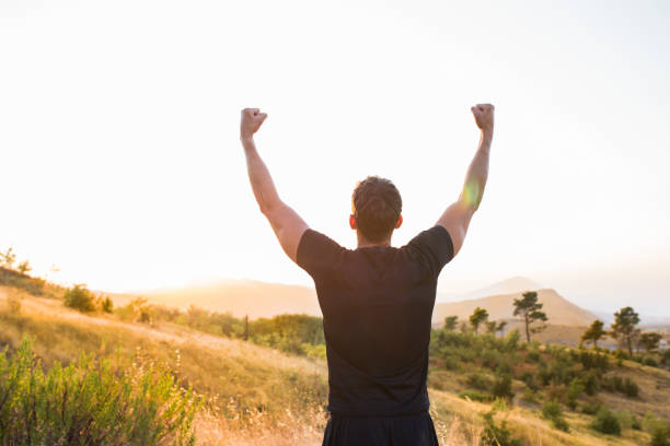istock Man winning his life race 1337247803