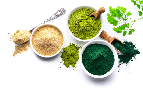 istock Powdered Spirulina, maca and moringa on white 1337251175