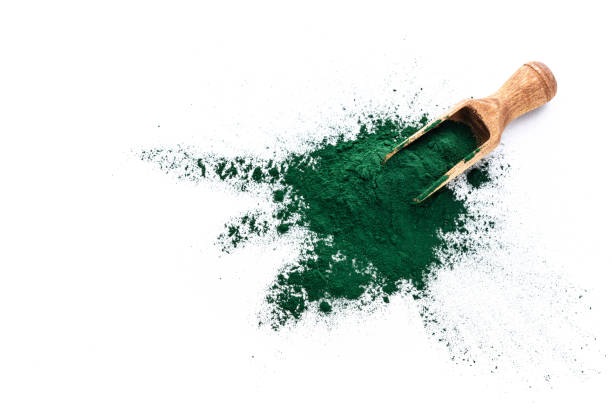 istock Spirulina powder heap shot from above on white 1337251226