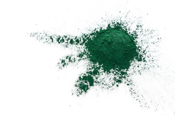 istock Ground Spirulina spilling on white background 1337251229