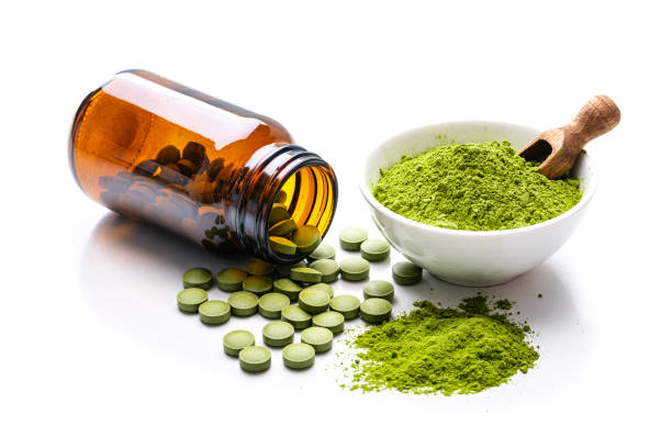 istock Moringa powder and pills on white background 1337251254