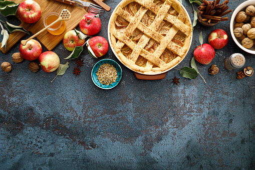 Apple pie with lattice pastry, traditional pastry dessert for Thanksgiving day, autumn baking concept, top view