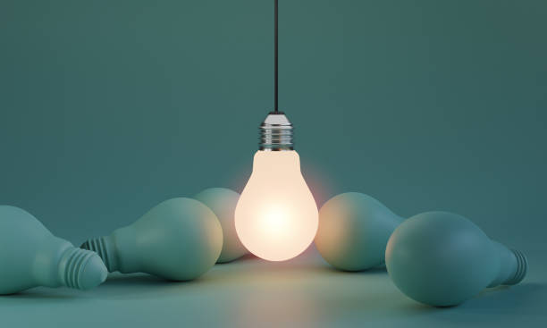 One of Lightbulb glowing among shutdown light bulb  in dark area with copy space for creative thinking , problem solving solution and outstanding concept by 3d rendering technique. One of Lightbulb glowing among shutdown light bulb  in dark area with copy space for creative thinking , problem solving solution and outstanding concept by 3d rendering technique. ideology stock pictures, royalty-free photos & images