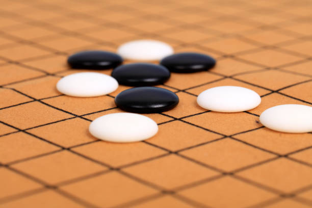 istock chinese game go,  Gobang and go game board 1337253388