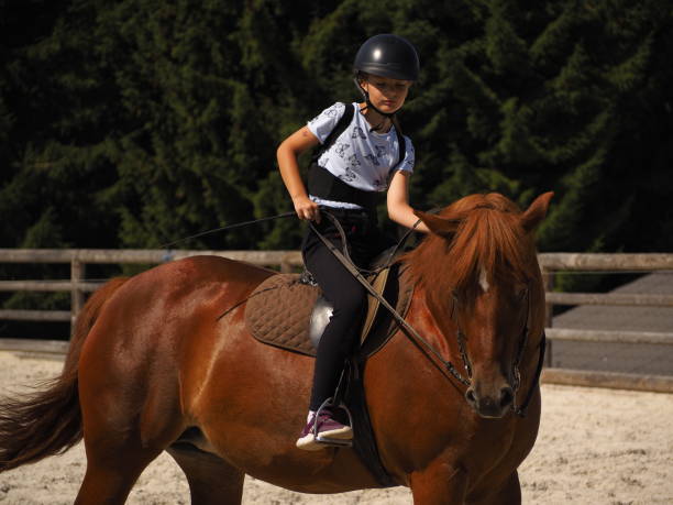 istock Girl riding horse 1337254221