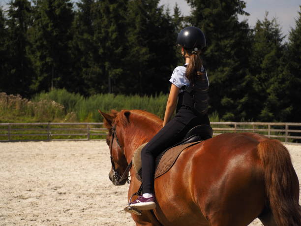 istock Girl riding horse 1337254236