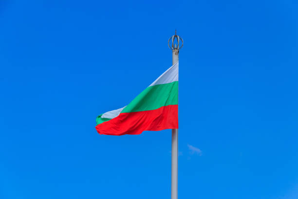 istock Waving flag of Bulgaria against blue sky 1337254452