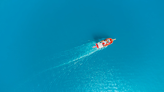 aerial view of tourboat on the perfect blue sea at aegean sea çeşme Turkey