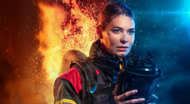 Female firefighter after work with a mask and a self-contained breathing apparatus